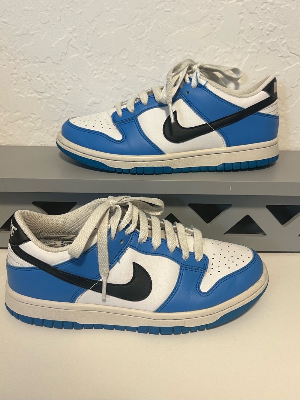 Nike Dunk Low “Photo Blue” in blue, white, and black. Boys size 5Y